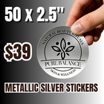 Hand holding a round metallic silver sticker with "Pure Balance Skin & Wellness" logo labeled "Natural Beauty Rituals" size 50 x 2.5 inches priced at $39 with bold text "Metallic Silver Stickers" on a gradient background