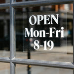 Business hours window cling with open schedule text 'OPEN Mon-Fri 8-19' applied on glass door removable decal for storefront