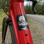 Custom bicycle sticker on red bike frame – durable vinyl bike frame sticker with mountain design