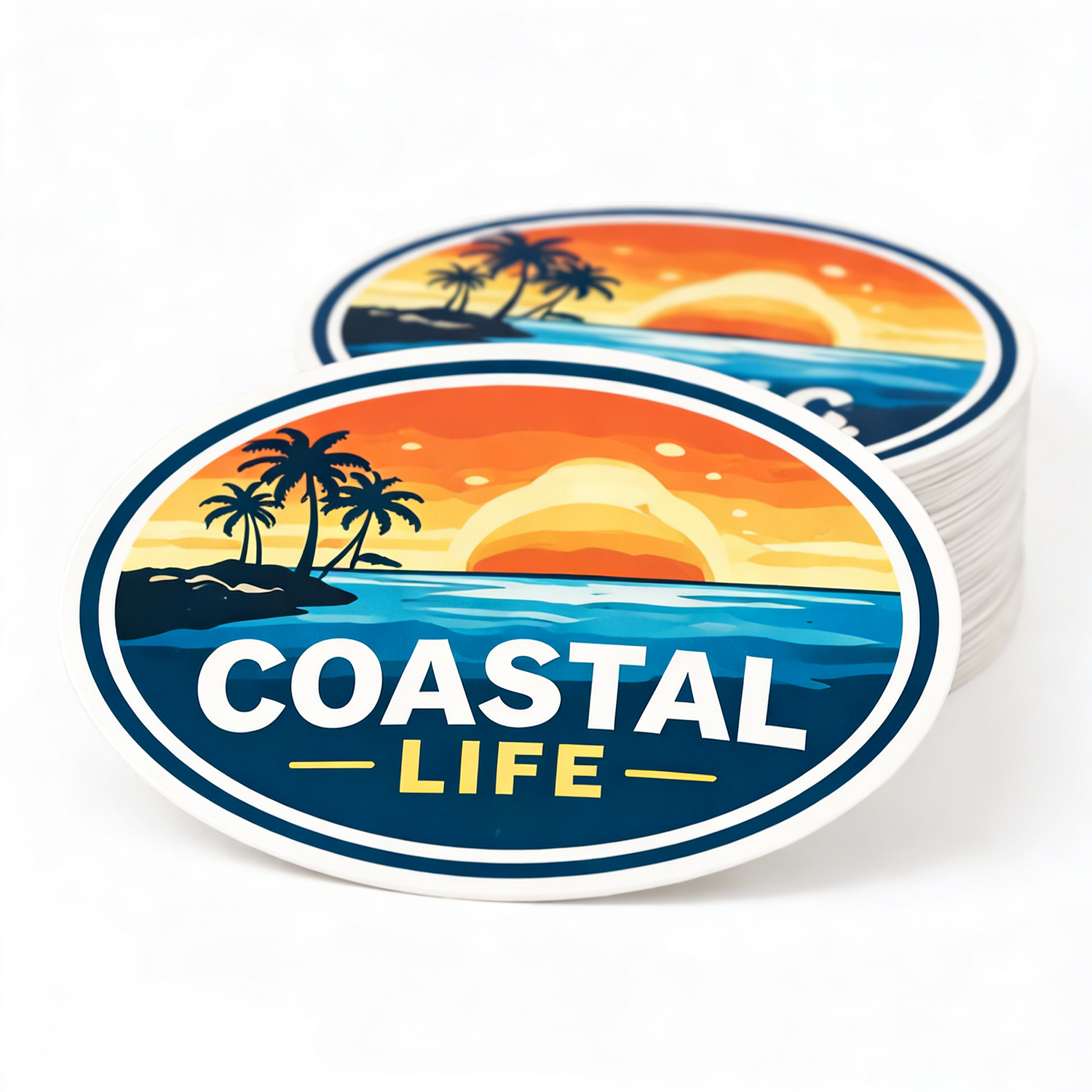 Stack of 'Coastal Life' themed stickers with a sunset and palm tree design.