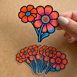 Colorful flower clear stickers held by a hand on a brown surface, full color printing