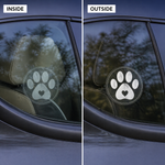 Comparison of a car window with a paw print decal viewed from the inside and outside.