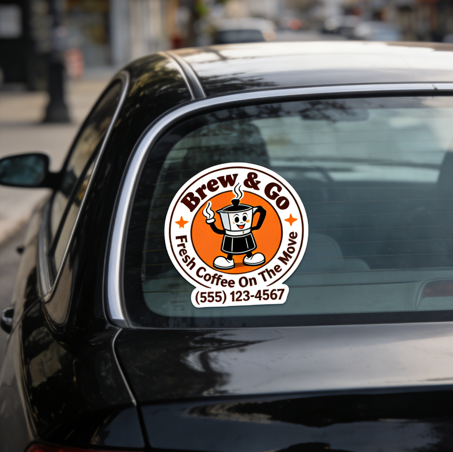 Custom outdoor stickers showing a business logo on the rear windshield of a black car parked street-side.