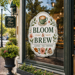 Elegant custom heavy duty stickers featuring a cafe brand design applied to the glass door of a storefront.