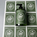 Green rectangular sheet labels applied to a cosmetic bottle and matching boxes, demonstrating cohesive brand packaging.
