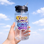 Hand Holding clear water bottle with custom 'Keep Yourself' stickers against a blue sky background