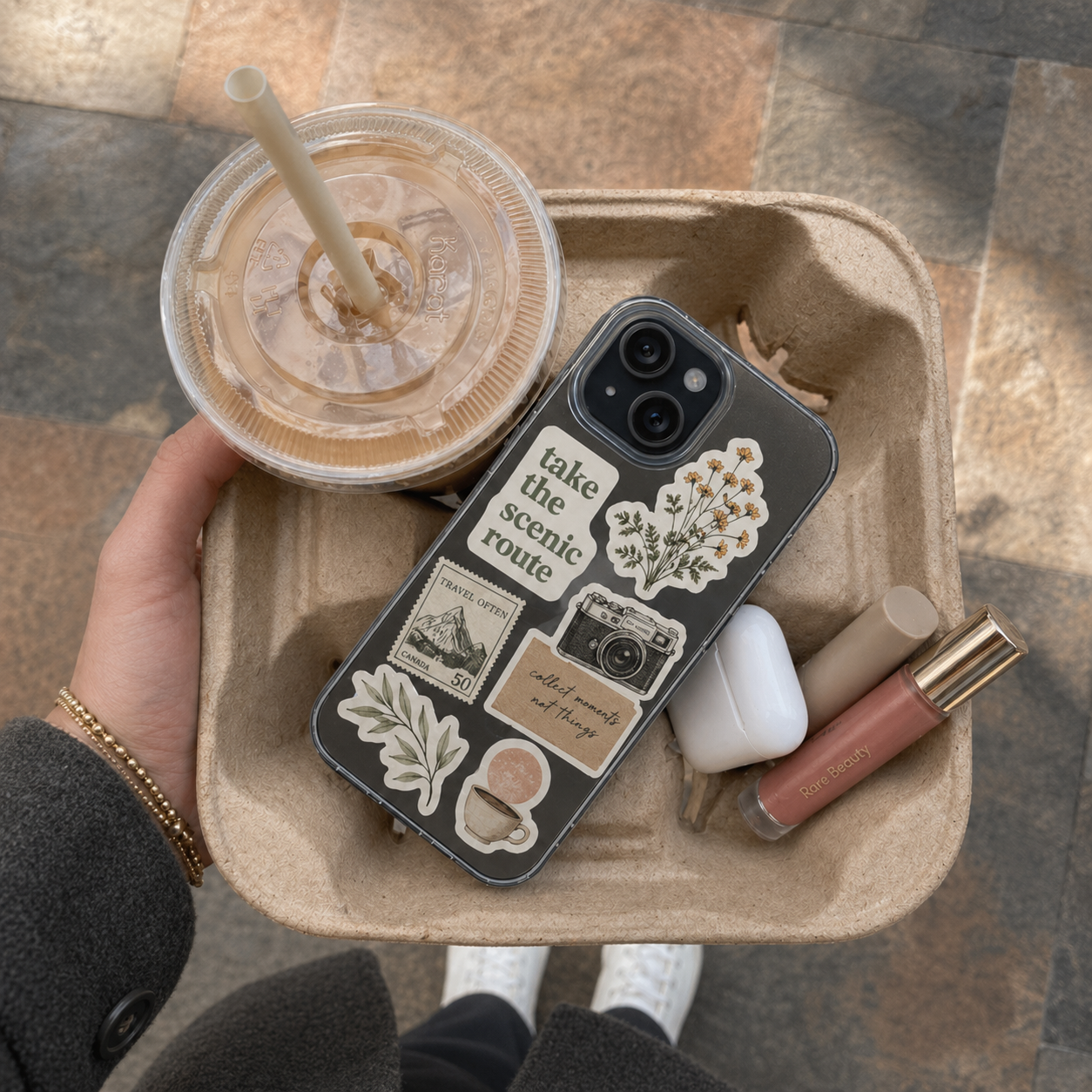 Custom phone stickers on phone in daily setting – stylish stickers for phones and laptop accessories