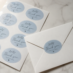 Light blue oval sheet labels for thank-you envelopes, featuring custom printed stickers used as elegant envelope seals