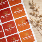 Orange rounded corner sheet labels for salon branding, custom printed beauty stickers arranged on label sheets