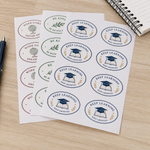 Oval sheet labels for education and classroom rewards, featuring Keep Learning stickers with graduation cap artwork printed on label sheets beside a notebook and pen