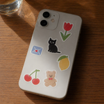 Phone case with custom colorful stickers on a wooden surface