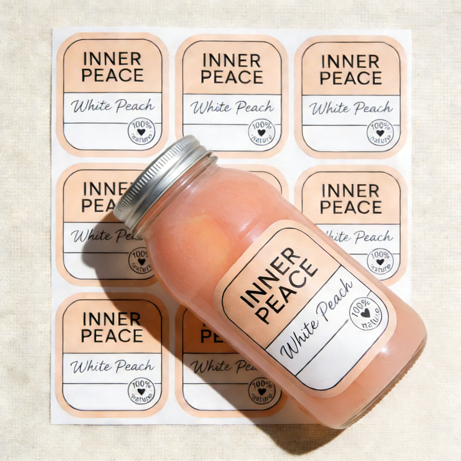 Rounded corner sheet labels for jars, featuring peach Inner Peace product stickers on label sheets and a glass candle container