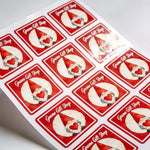 Sheet of square labels with gnome design and 'Gnome Gift Shop' text on a white background