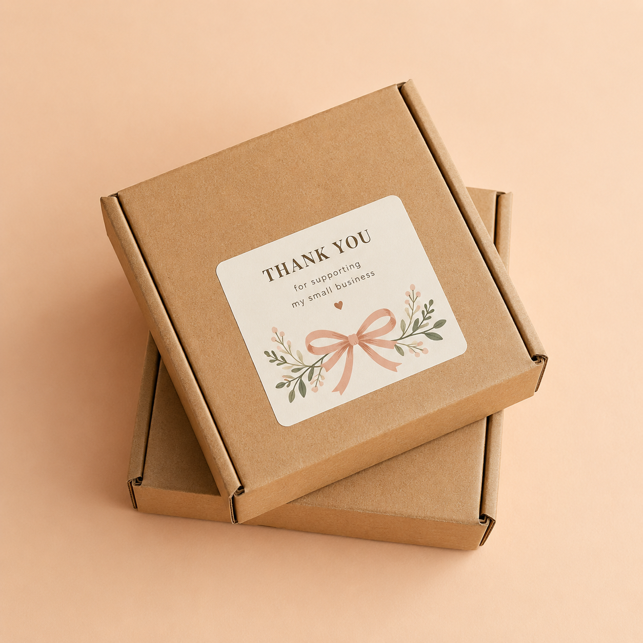 Brown cardboard box with a 'Thank You' vinyl sticker on a beige background