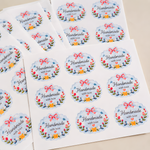 Sheet of 'Handmade with love' stickers with floral designs on a white background