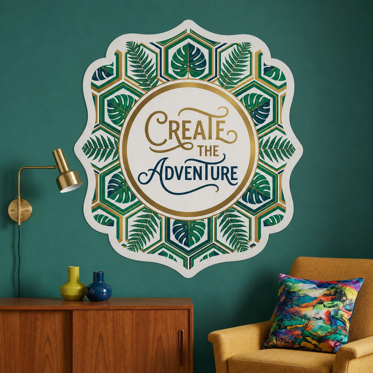 Stunning wall art stickers large mandala leaf pattern reading "Create the Adventure" on a dark teal living room wall.