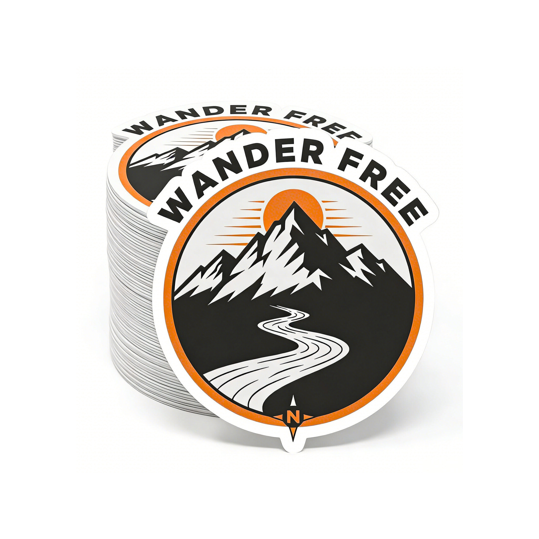Stack of 'Wander Free' stickers with mountain and road design on a white background