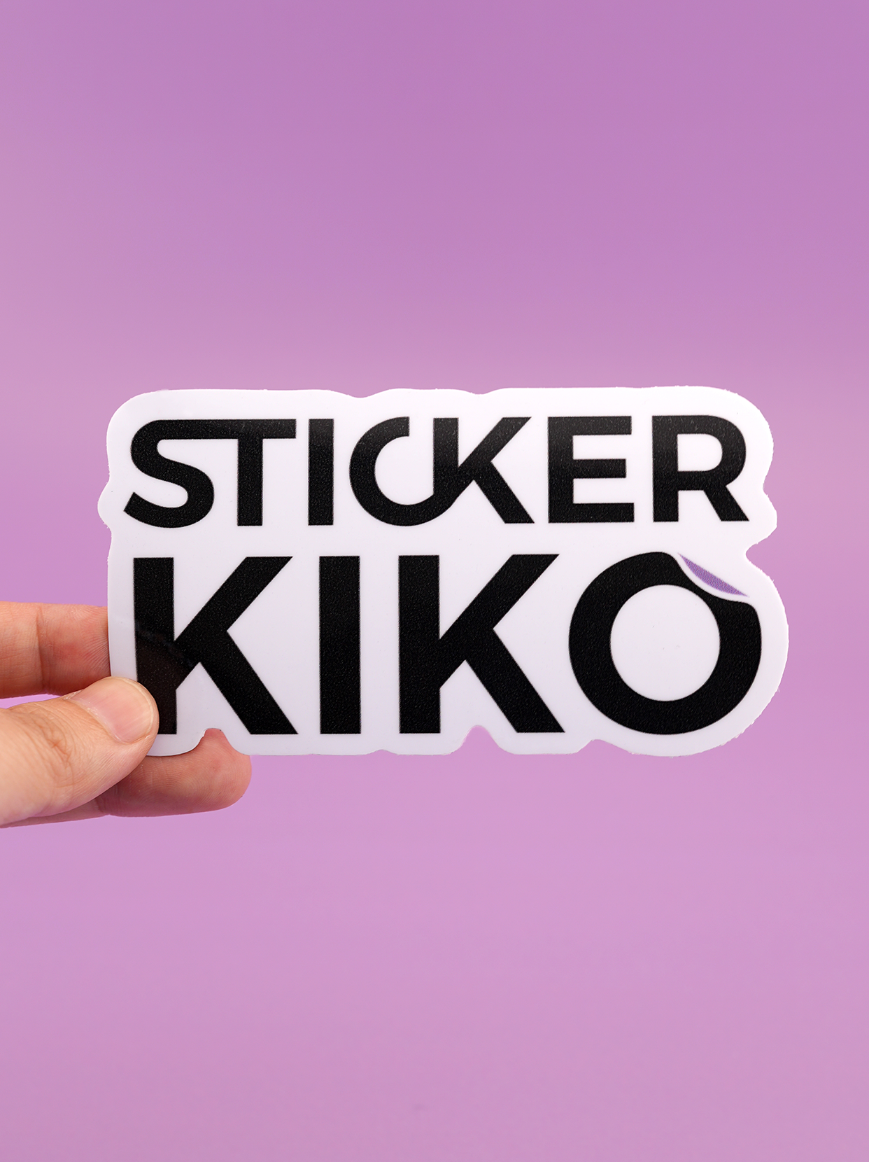 Sticker Kiko brand logo vinyl sticker held in hand against a purple background.