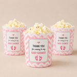 Baby shower favor stickers on popcorn cups for personalized party snacks