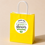 Custom Baby shower thank you sticker applied to a yellow gift bag for party favors