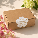 Beauty packaging sticker on a kraft box with floral styling