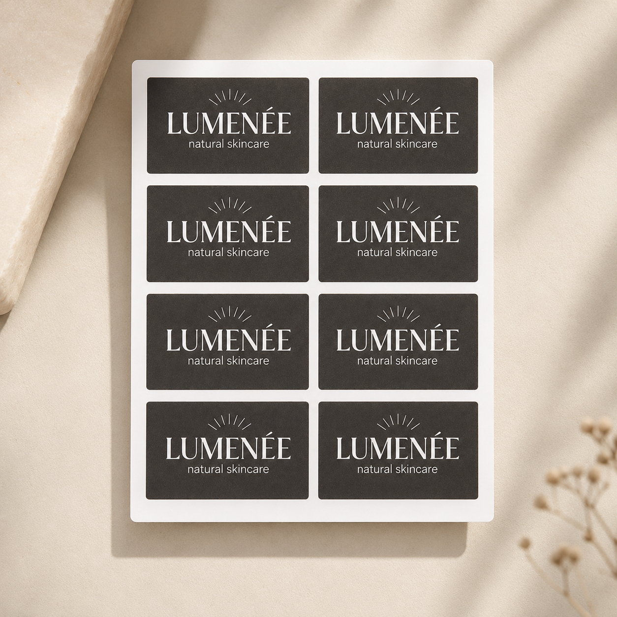 Black rectangle label sheet with Lumenée natural skincare branding