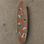 A simple wooden cruiser skateboard with black waterproof skateboard stickers, placed outdoors on concrete.