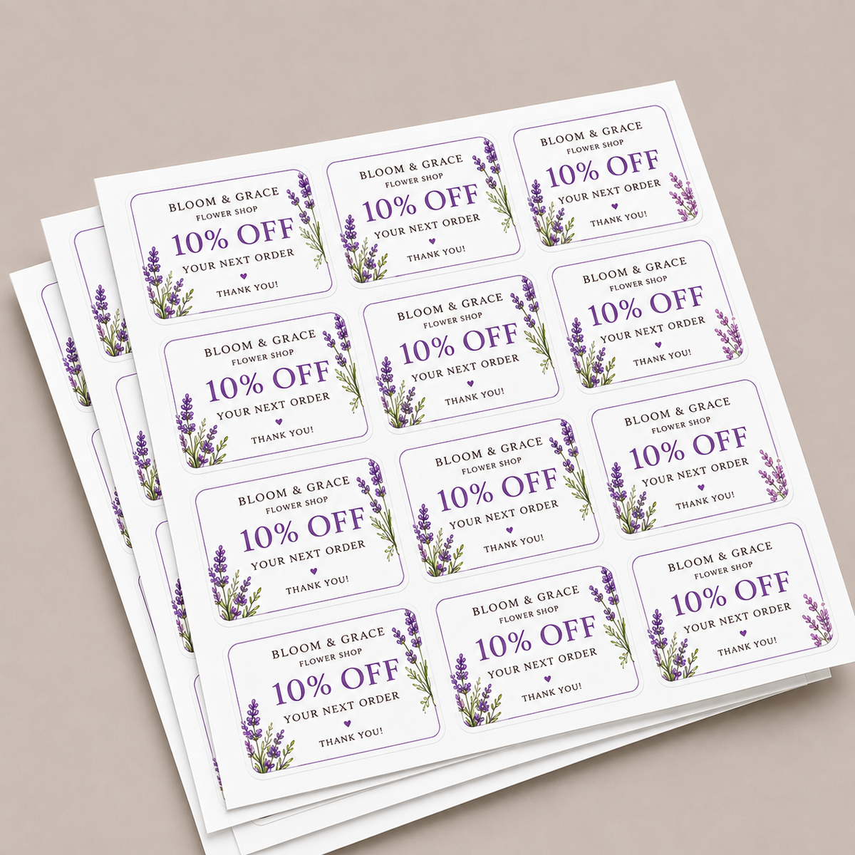 Custom rounded corner labels featuring a Bloom and Grace flower shop 10% off discount design on sticker sheets.
