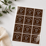 Brown square sheet labels for coffee packaging arranged on a glossy label sheet