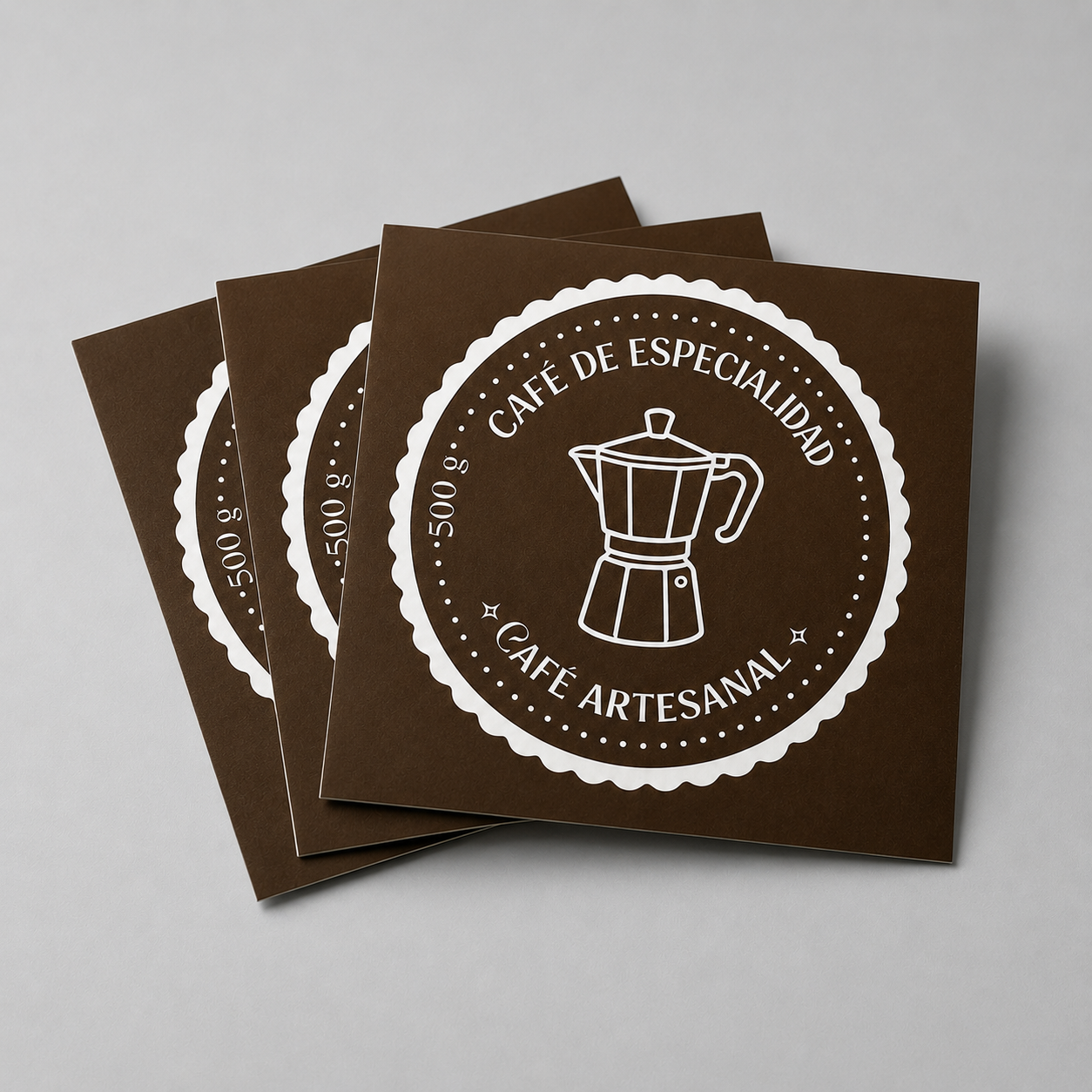 Stack of brown custom square stickers with a white coffee logo design