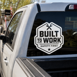 Durable 'Built To Work Safety First' vinyl graphic sticker with crossed wrenches icon on a white pickup truck rear window.