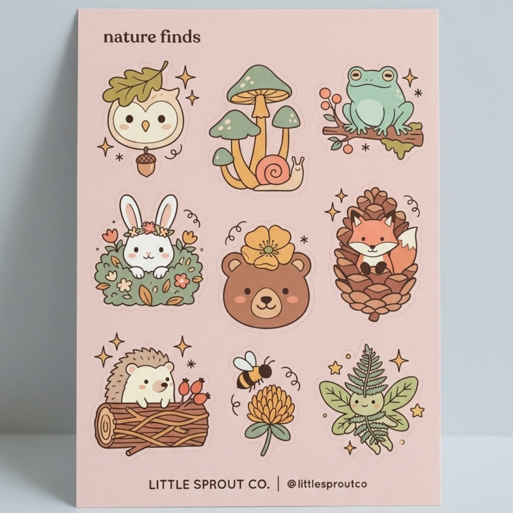 Sticker sheet with nature-themed illustrations of animals and plants on a pink background.