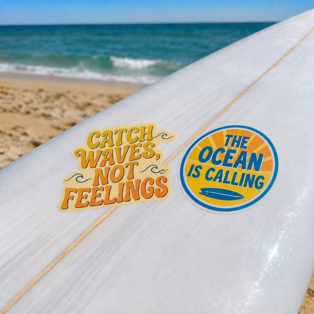 Surfboard displaying "Catch Waves, Not Feelings" and ocean-themed stickers