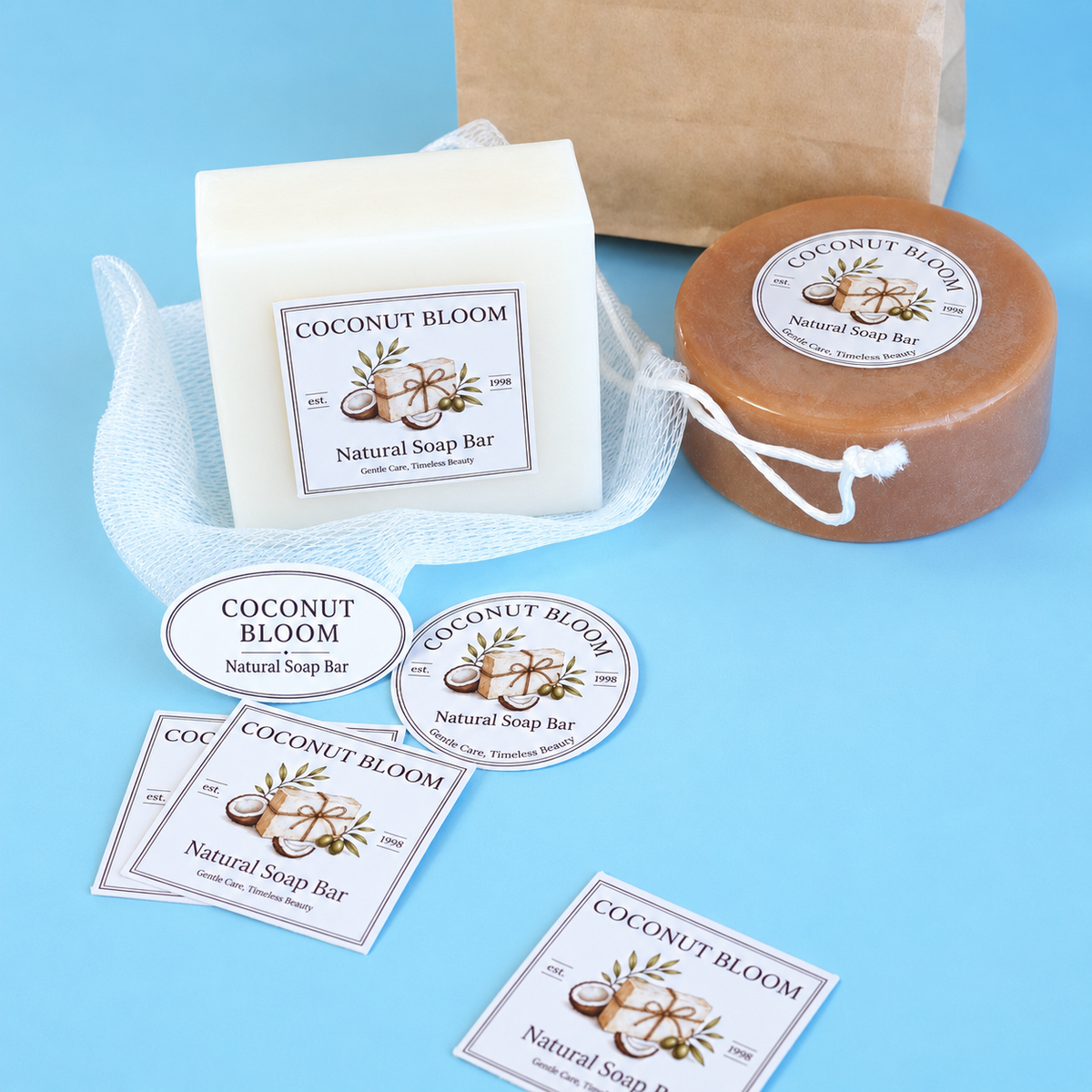 Custom stickers featuring Coconut Bloom natural soap bar designs applied on soap bars.