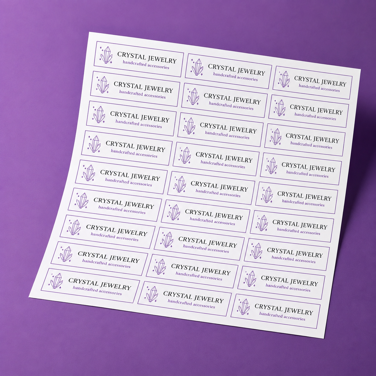 our custom rectangle sheet labels featuring crystal jewelry branding on a purple background.