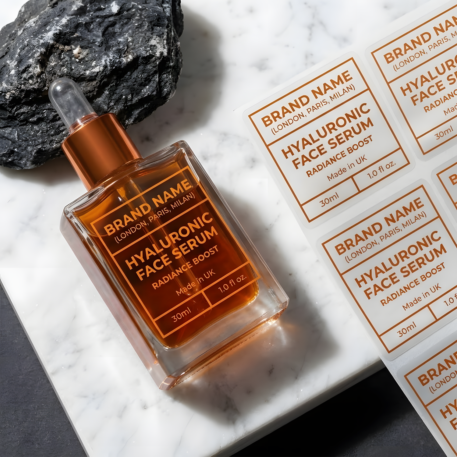Custom clear labels applied to a glass facial serum bottle with matching labels displayed on a sheet.