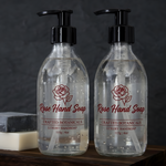 Waterproof clear labels with red printing applied to transparent pump bottles of rose hand soap.