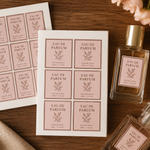 Custom cosmetic labels on white vinyl sheets applied to eau de parfum glass perfume bottles for beauty brands