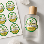 Custom green and gold glitter labels shown on a perfume bottle and matching label sheet