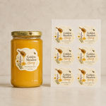 Custom die-cut vinyl label sheets featuring Golden Meadow Honey design next to a glass honey jar mockup, highlighting waterproof vinyl material for product packaging.