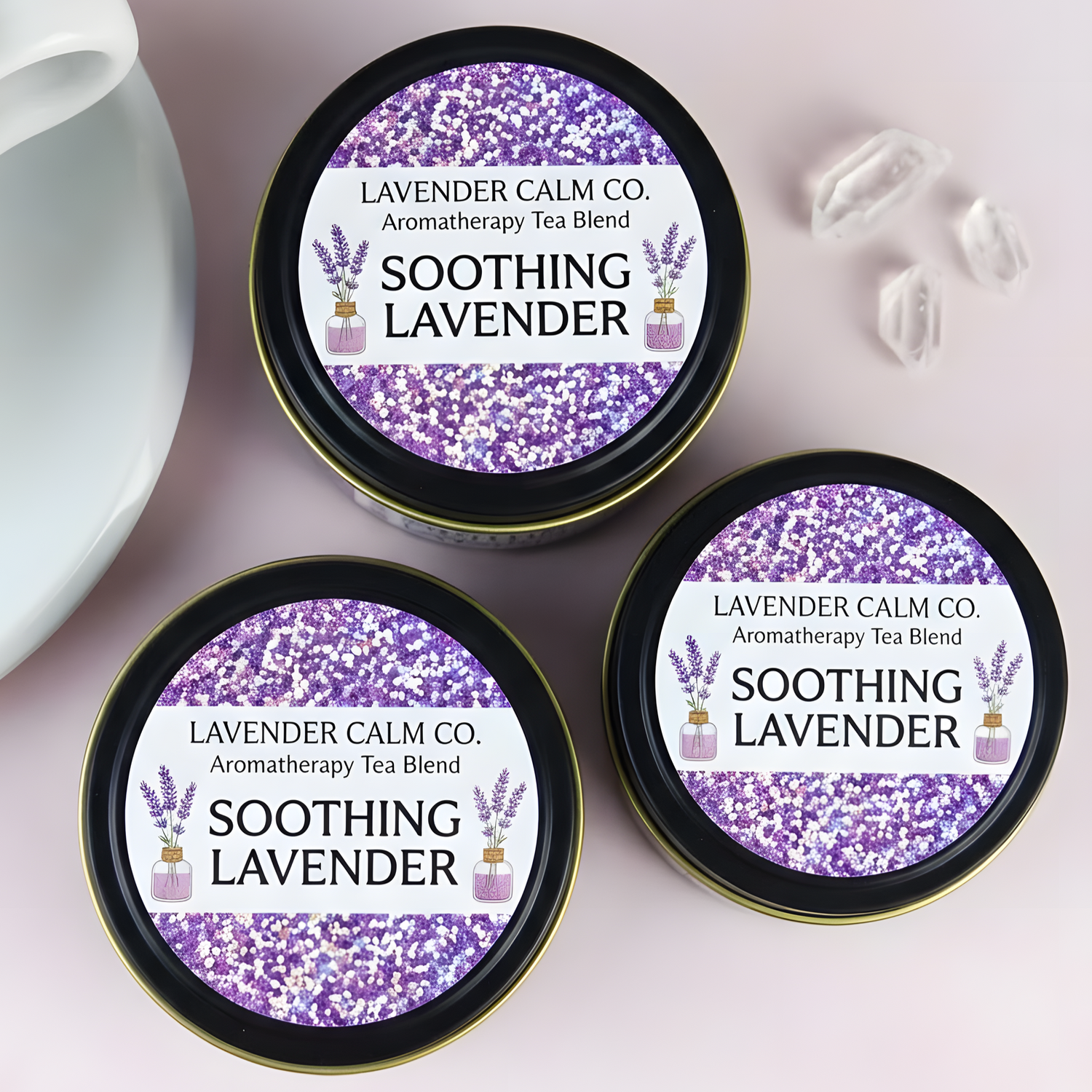 Custom purple glitter labels applied to round lavender tea tins with clear product text and botanical illustrations.