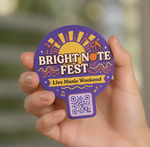 Custom QR code sticker for a live music weekend event, featuring a purple round festival design with bold lettering, music notes, and a scannable QR code.
