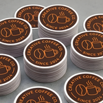 Bulk custom round logo stickers for coffee brands, ideal for packaging, cups, bags, and small business branding.