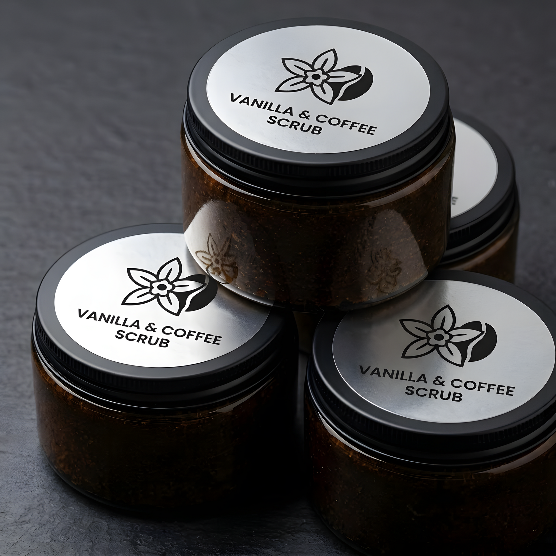 Custom round silver metallic labels applied to jars of vanilla and coffee body scrub.