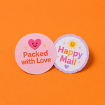 Two custom round vinyl packaging stickers featuring 'Packed with Love' and 'Happy Mail' designs on an orange background.
