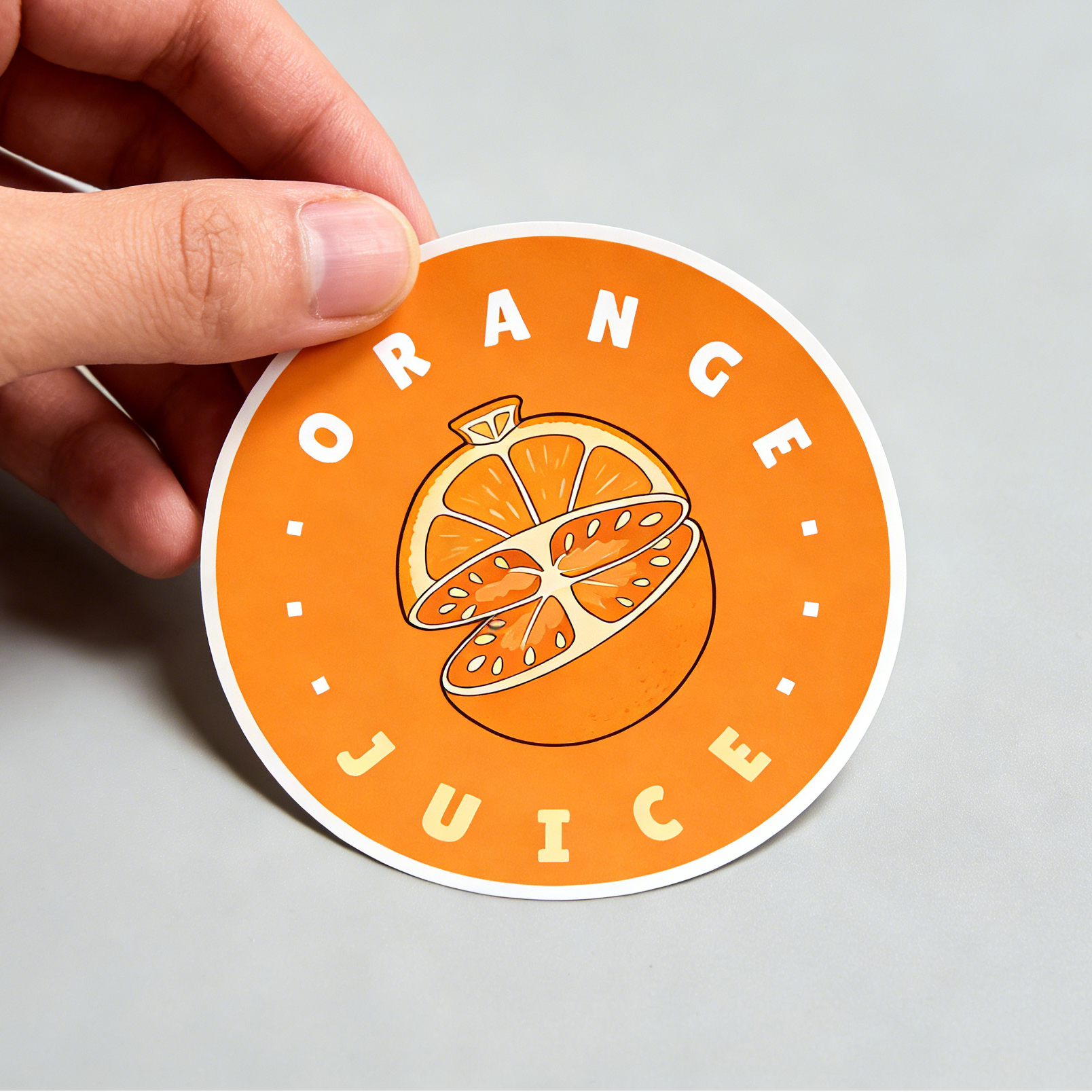 Custom round waterproof vinyl sticker with orange juice graphic, ideal for juice brand labels, water bottles, and promotional giveaways.