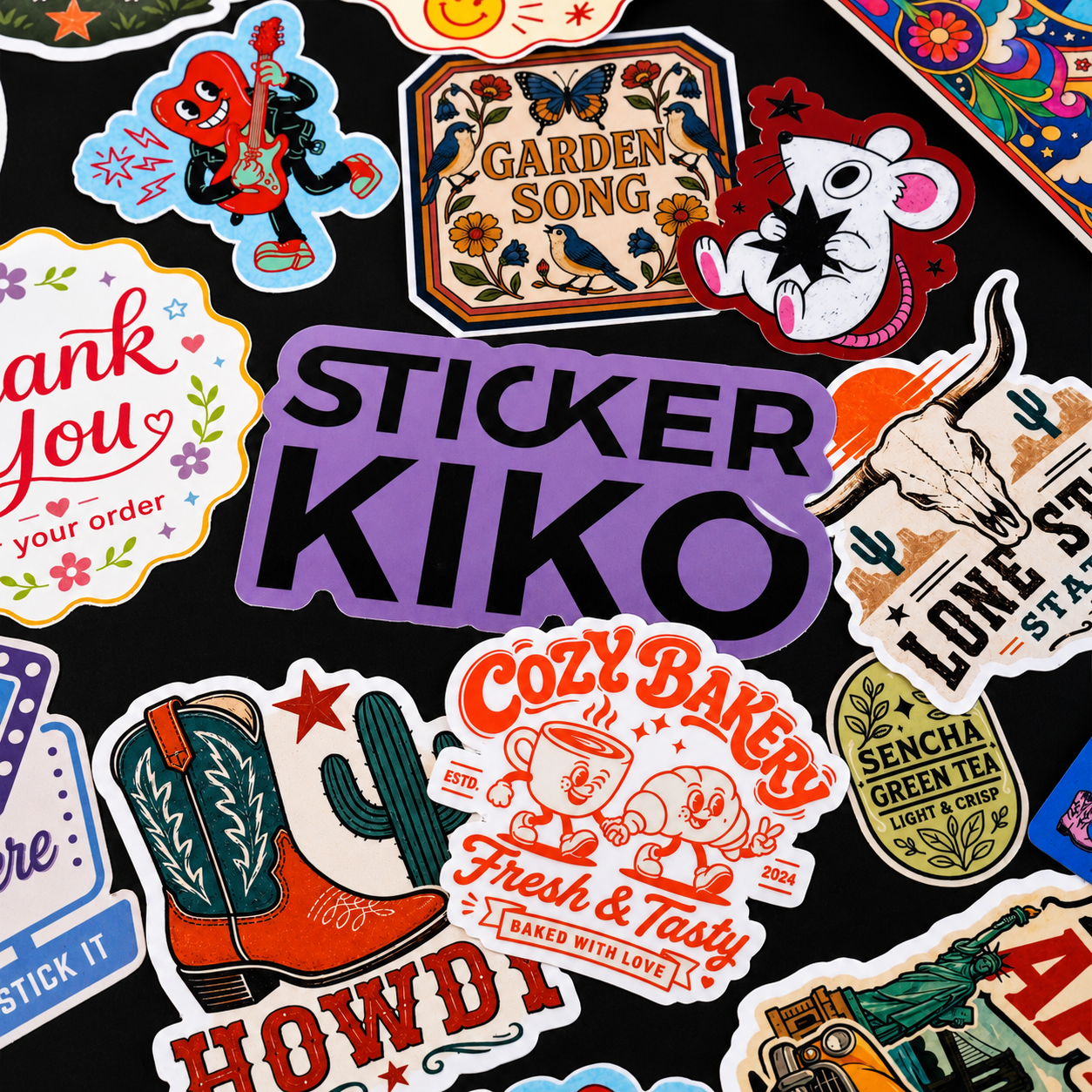 Colorful custom vinyl stickers featuring bakery, western, floral and illustrated designs on a black background.