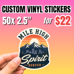 Hand holding a mountain adventure-themed die-cut sticker, promoting 50 pieces of 2.5-inch custom vinyl stickers for $22.
