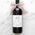 Custom wedding wine label featuring a bride and groom silhouette in pink and white, personalized with names and wedding date.