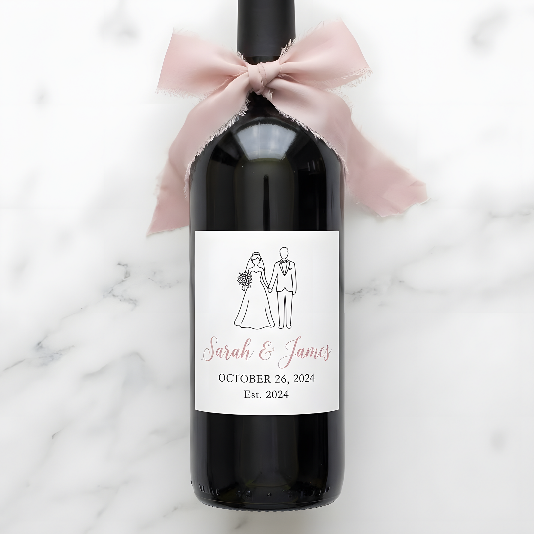 Custom wedding wine label featuring a bride and groom silhouette in pink and white, personalized with names and wedding date.